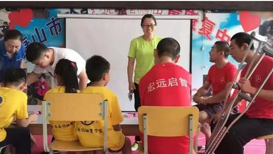 Summer camp children visit a Tangshan rehabilitation centre