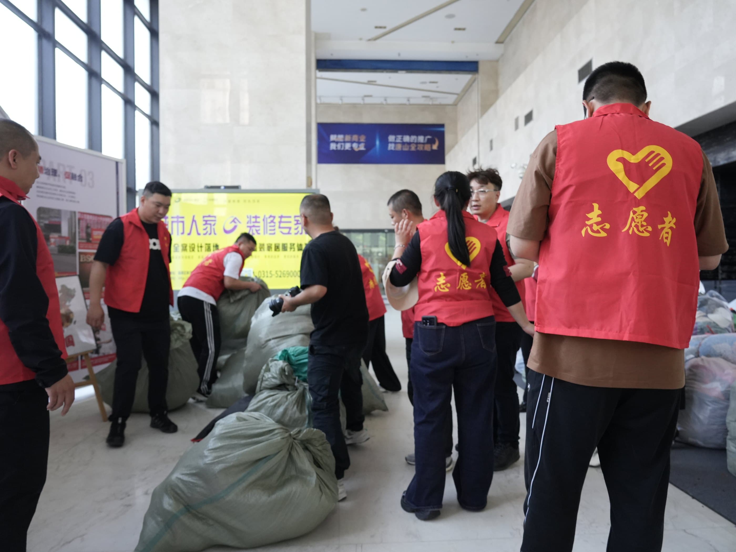 Packing donated clothing for Qinghai