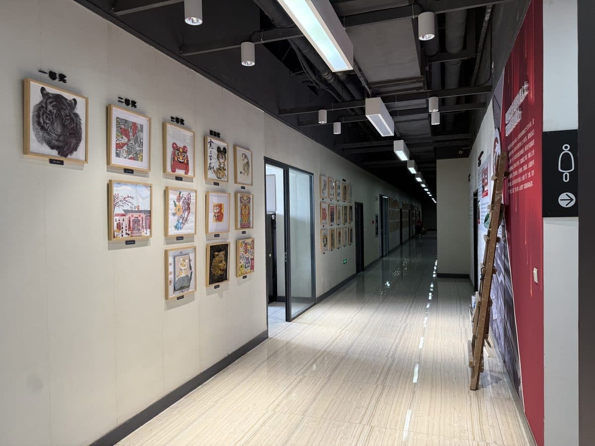 A corridor hung with pictures