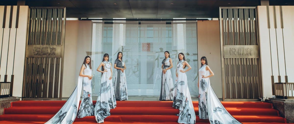 Hostesses receive the guests