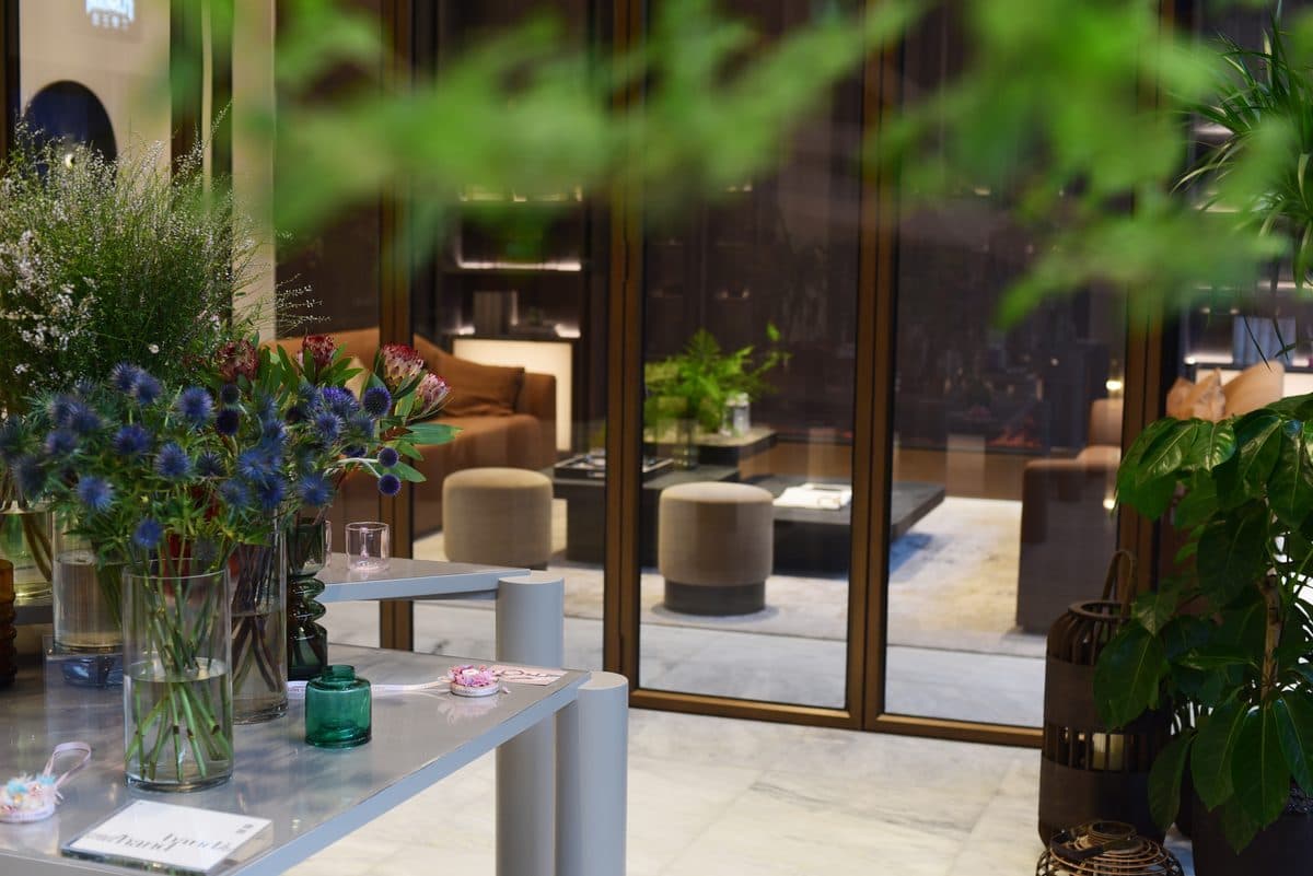 Sales gallery interior with planting and full-height glazing